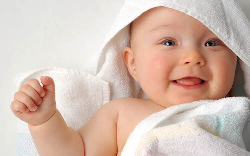 cute baby wrapped in towel
