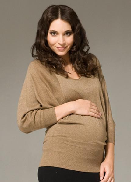 Pregnant model wearing Ripe Maternity Batwing Knit Maternity Top in caramel colour
