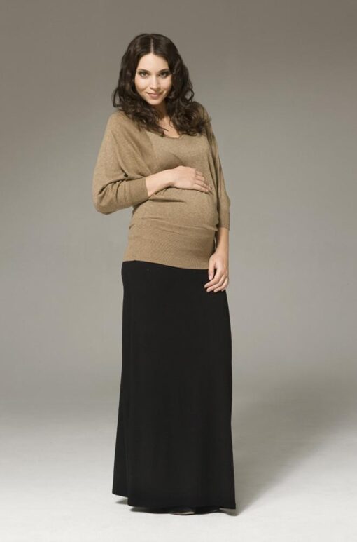 Pregnant model wearing Ripe Maternity Batwing Knit Maternity Top with black maxi skirt