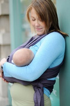 mum breastfeeding in baby ktan 