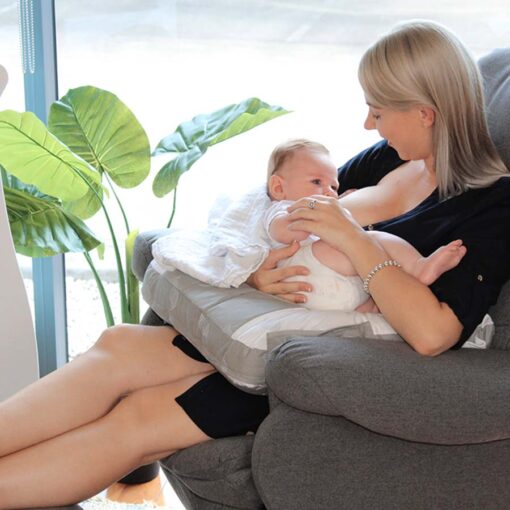 mum using organic nursing pillow to support baby on her lap
