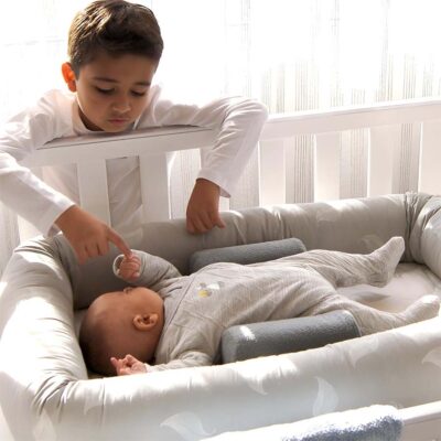 breathe eze organic cosy crib with baby in cot