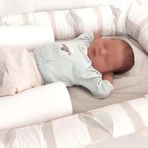 breathe eze sleep positioner supporting baby in cosy crib