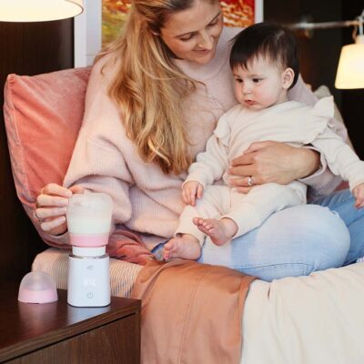 jiffi bottle warmer home mum and baby on bed
