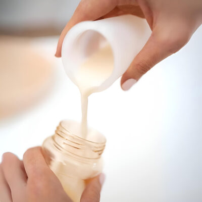 pouring breastmilk into eco pod storage