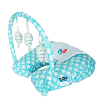 nursing pillow in turquoise circle with toy bar