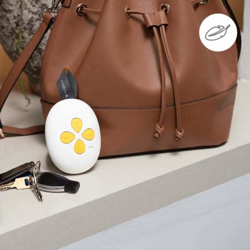 medela solo single electric breast pump controls next to hand bag