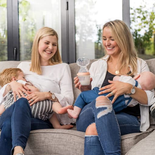 mum with baby holding haakaa generation 3 silicone breast pump